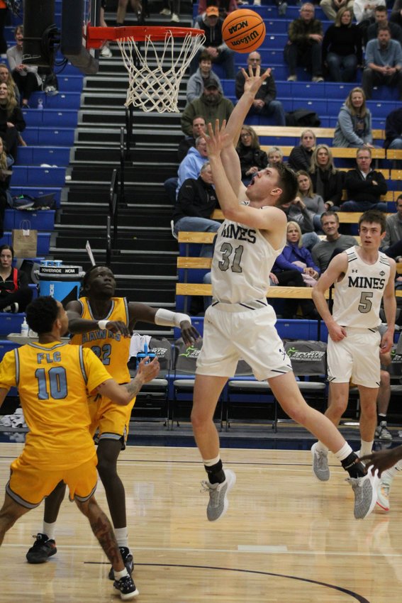 Colorado School of Mines senior forward Adam Thistlewood nabs an offensive rebound and puts it back for two points during the Jan. 27 home game against Fort Lewis.